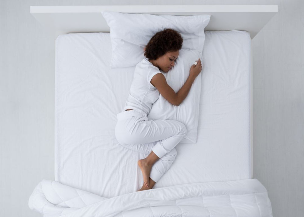 Black Female in fetal position in Bed Suffering In Pain